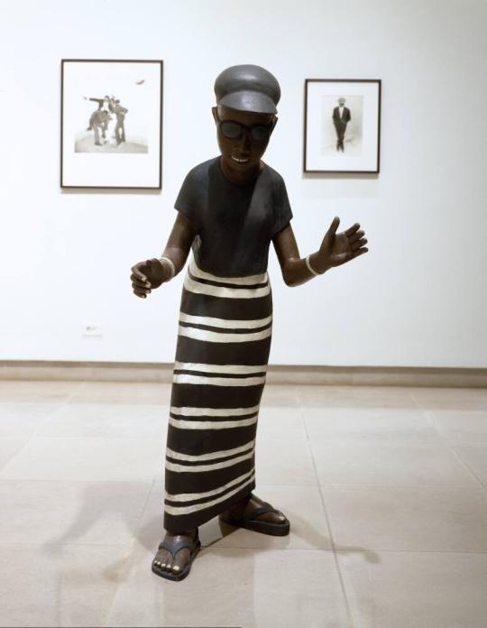 Dancing Woman in Striped Dress and Sunglasses