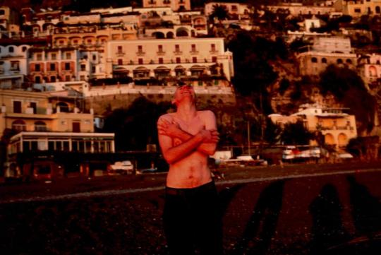 Pawel on the beach laughing, Positano