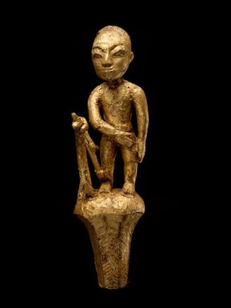 Linguist Staff Finial depicting a Man Caught in a Trap