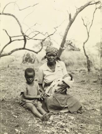 Narame Fausta with her daughter Esther and her newborn, Makantamba ("One who was born at the time of war"), Rwandan refugee camp, Lumasi, Tanzania