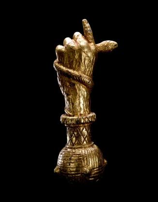 Sword handle of a hand holding a snake