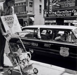 Daddy, I Want To Be Free Too. William Edwin Jones pushes daughter Renee Andrewnetta Jones during protest march on Main St., Memphis, Tennessee.