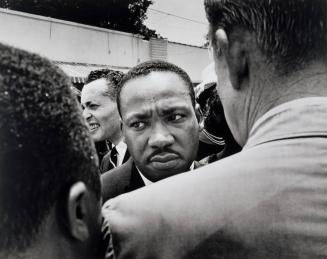 Dr. Martin Luther King is Confronted. Dr. King is stopped by police at Medgar Ever's Funeral. Jackson, Mississippi.
