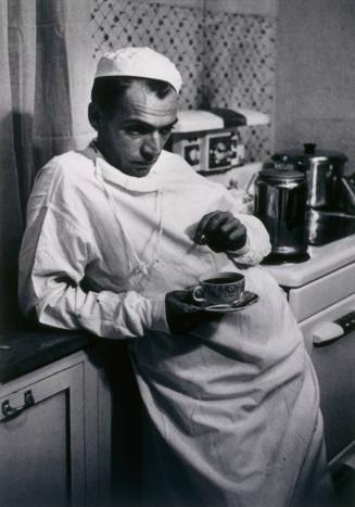 2:00 a.m., Dr. Ceriani has coffee and a cigarette in hospital kitchen