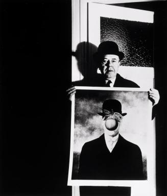 René Magritte with his painting The Great War, Brussels