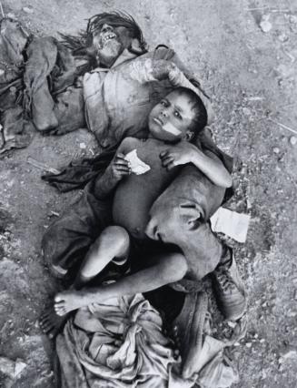 Man with Child Lying on Ground, India