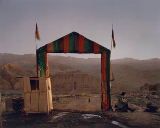 Victory arch built by the Northern Alliance at the entrance to a local commander's headquarters in Bamiyan.  The empty niche housed the smaller of the two Buddhas, destroyed by the Taliban in 2001