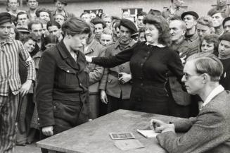 In a Deportee Camp, a Gestapo Informer is Recognized by a Woman She Has Denounced,  Dessau, Germany