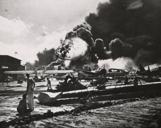 Pearl Harbor, taken by surprise, during the Japanese aerial attack. Wreckage at Naval Air Station, Pearl Harbor.