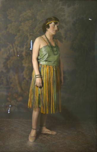 [Woman in green & yellow dress]