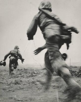 Hold the Phone—Two Marine wiremen on Iwo Jima race across an open field, under heavy enemy fire to establish field telephone contact with the front lines.