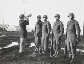 Lt. Lloyd Ahvakana at the rifle inspection, Alaska