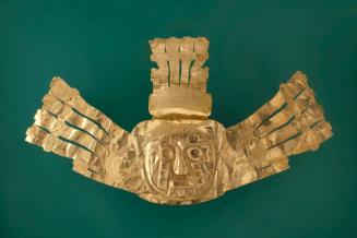 Crown ornament depicting the face of the Sun God