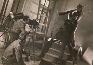 [Georgy Zelma photographing a scene staged by El Lissitzky for an issue of USSR in Construction devoted to the fifteenth anniversary of the Red Army]