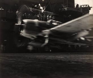 A Grumman F6F Hellcat takes off from the deck of the USS Lexington