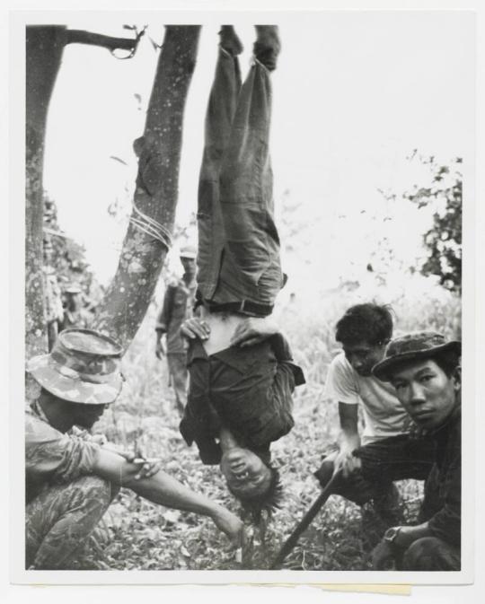 Vietcong suspect being interrogated by Nung Mercenaries working for the U.S. Special Forces in South Vietnam War Zone "C"