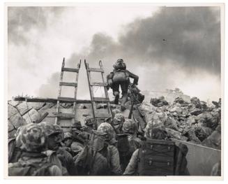 Leathernecks use scaling ladders to storm ashore at Inchon in amphibious invasion