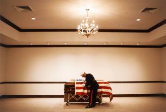 Man Draping Flag on Coffin, Nevada