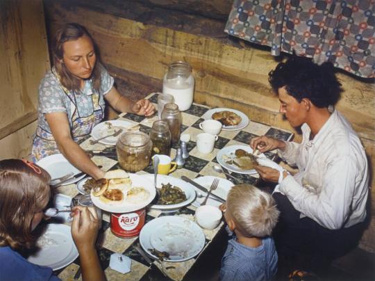 The Fae and Doris Caudill family, eating dinner in their dugout