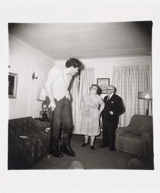 A Jewish giant at home with his parents in the Bronx, N.Y. 1970