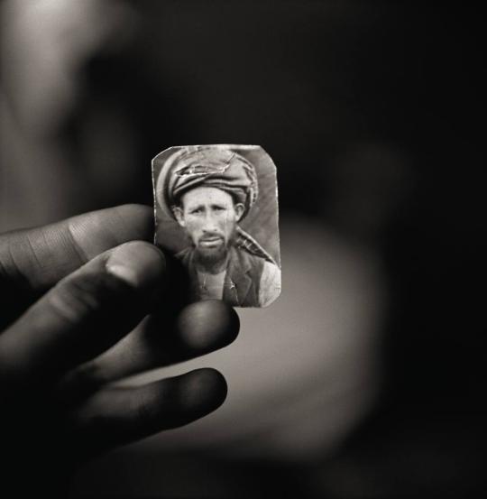 Abdul Aziz, Holding a Photograph of His Brother, Mula Abdul Hakim, Afghan Refugee Village, Khairabad, North Pakistan