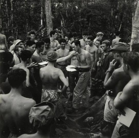 Navy Personnel on Munda, New Georgia, Gather Around Chief Yeoman Willis to Receive Their Mail