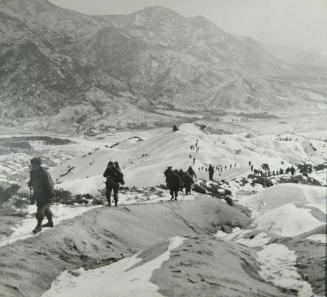 Men Of The 3rd Battalion, 19th Infantry Regiment, US 24th Infantry Division, Work Their Way Over The Snowy Mountains Attempting To Locate The Communist Lines And Positions