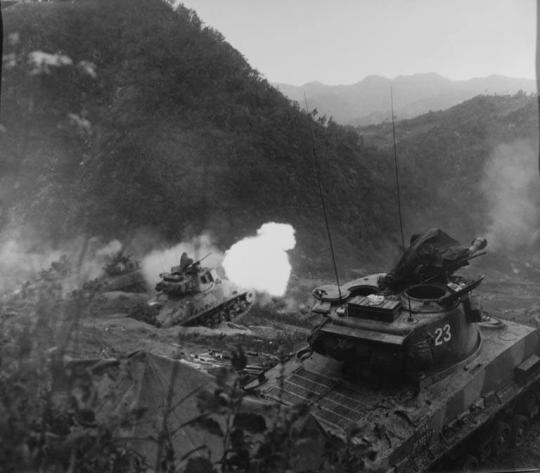 M-4 Tanks of the 23rd Infantry Regiment, 2nd US Infantry Division, Blasts Communist Held Positions, during an Assault against the Chinese Communist Forces, North of Pia-ri, Korea, on the East Central Front