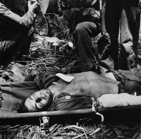 Marine PFC Arthur N. Robinson, Wounded during the Fighting on Guam, Receives Plasma at a First Aid Station, July 1944