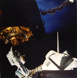 Mission: Space Shuttle 51-I, Discovery: James D. van Hoften and William F. Fisher on Extravehicular activity to repair the Syncom IV-3 communications satellite before it is redeployed