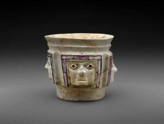 Shell Cup with Four Faces