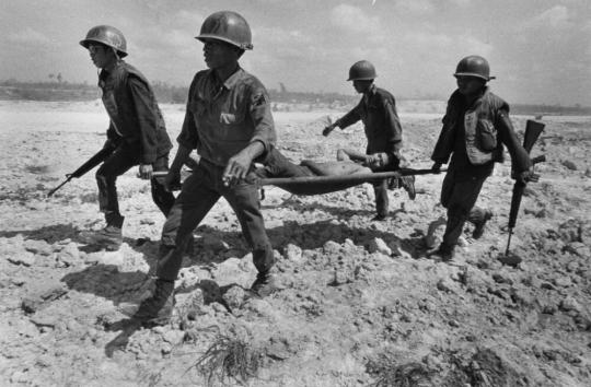 Shell-shocked soldier awaiting transportation away from the frontline, Hue, McCullin, Don