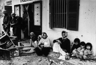 Vietnamese family after a grenade attack on their Bunker, Hue