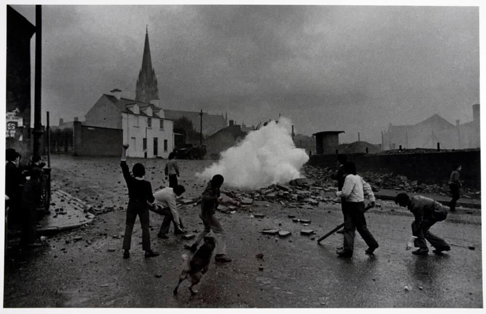 Don McCullin (English) Youths taunting British Soldiers, The Bogside, Derry, 1971