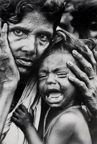Exhausted mother and child on the borders of Bangladesh and India