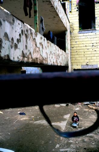 Playing in the remains of a bombed-out building