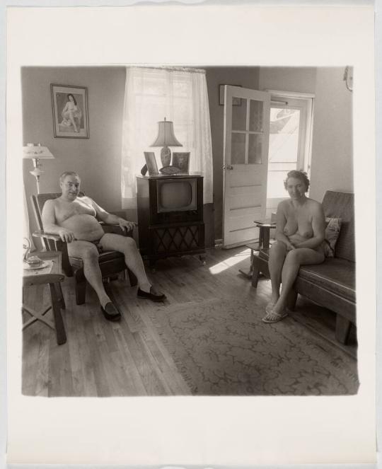 Retired man and his wife at home in a nudist camp one morning in N.J. 1963