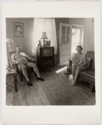 Retired man and his wife at home in a nudist camp one morning in N.J. 1963