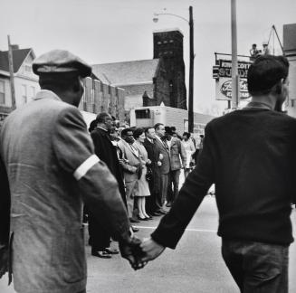 Bishop Frederick Jordan, AME Baptist Church, T.O. Jones, Head of Sanitation Workers, Walter Ruether, United Auto Workers, lead commemorative march. Memphis, Tennessee.