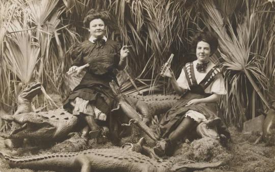 [Women Smoking and Drinking Surrounded by Alligators]