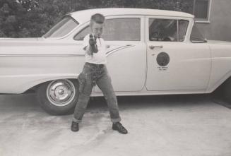 [Boy Posing with Gun]