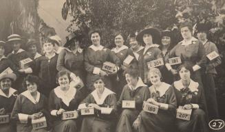 [Group of Women Holding Boxes with Numbers]