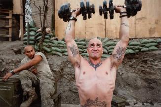 Untitled, Korengal Valley, Kunar Province, Afghanistan [Sergeant Stichter lifts weights]