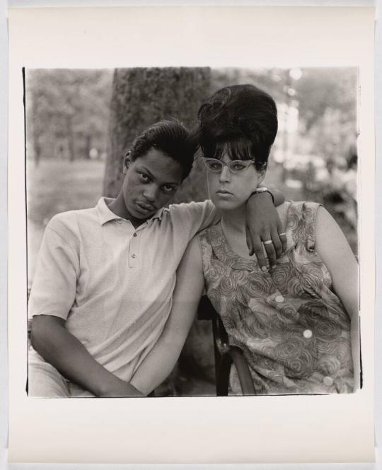 A young man and his pregnant wife in Washington Square Park, N.Y.C. 1965