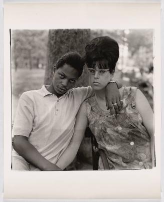 A young man and his pregnant wife in Washington Square Park, N.Y.C. 1965