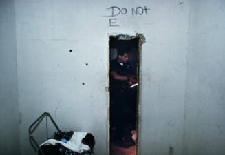 Pacific Division officers on patrol in Venice Beach inspect an abandoned house looking for squatter and drugs, LAPD