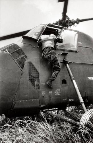 Farley tries to extricate pilot First Lieutenant Dale Eddy from Yankee Papa 13, Vietnam
