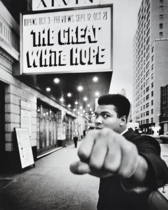 Boxing champion Muhammad Ali posing in front of the Alvin Theater during production of play "The Great White Hope", NY