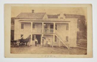 [People and Horse in Front of Building]