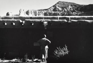 [O'Keeffe at Ghost Ranch, Walking Towards House]
